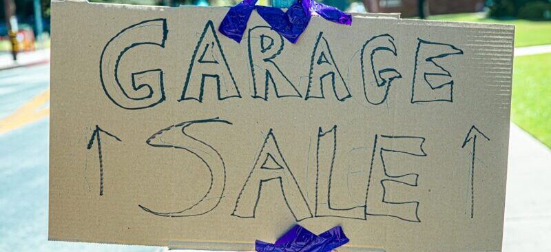Garage sale cardboard sign